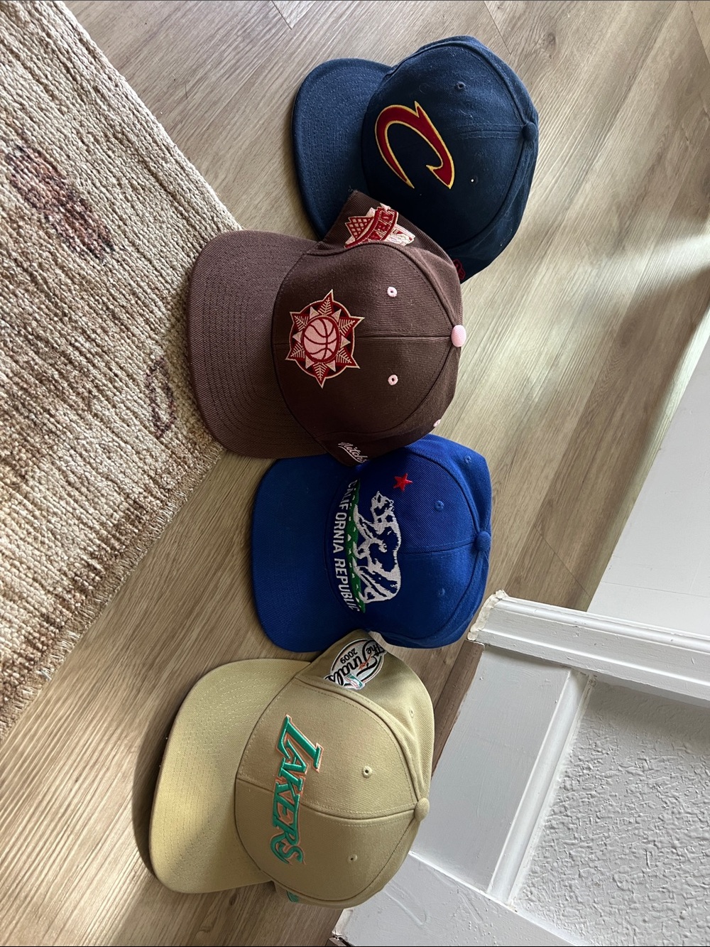 Fitted hats set of 4, like new, vary in sizes and can be sold separately